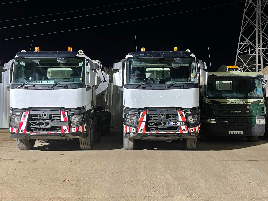 Fleet of Renault and Scania Concrete Trucks at Night